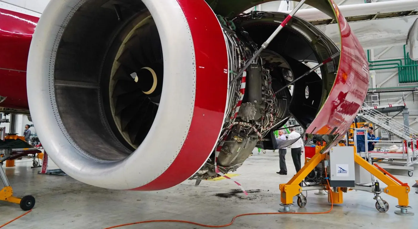 Aircraft engine with its cowlings open during maintenance